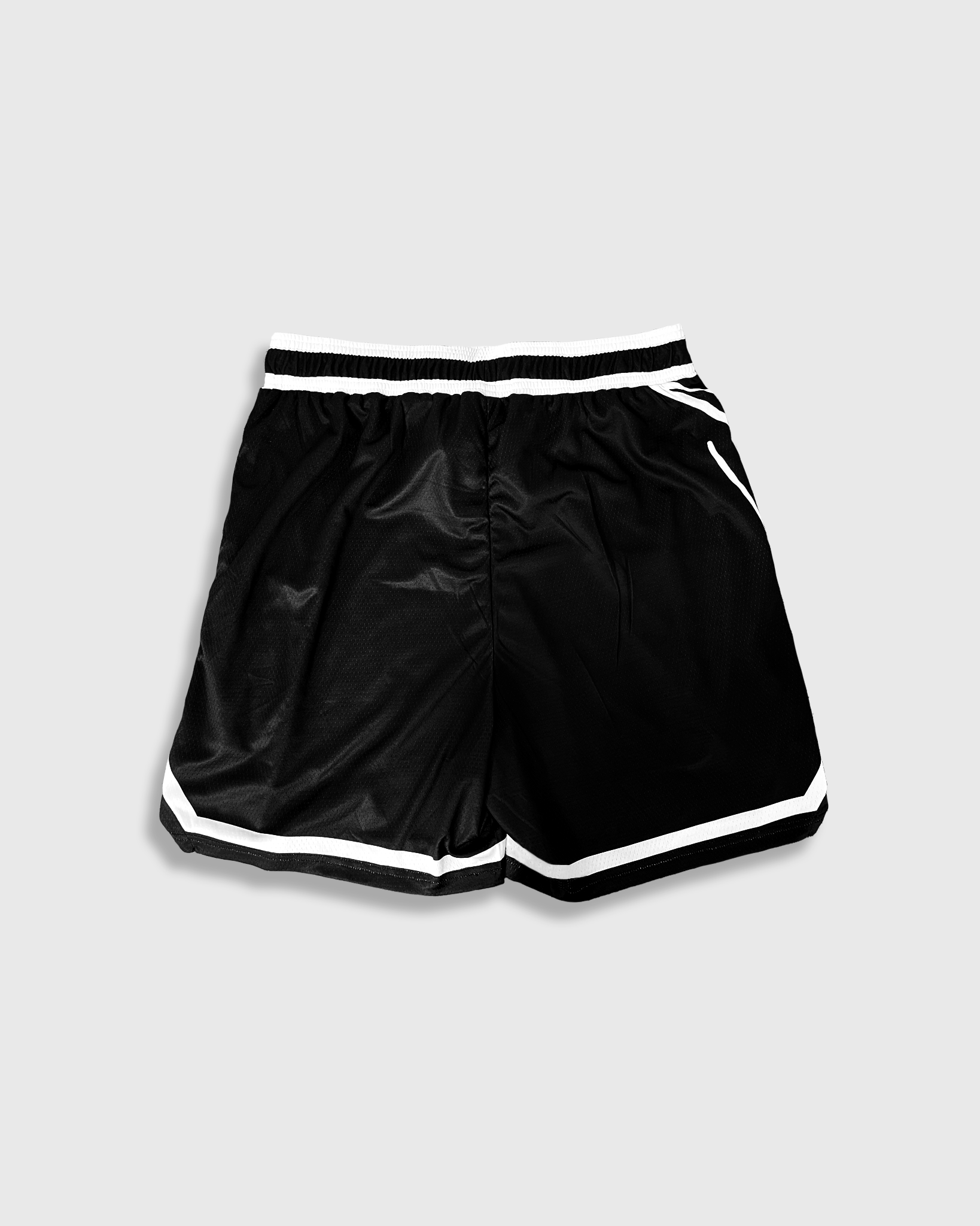 Back view of black Vision Twins basketball shorts with white trim and elastic waistband, made from breathable athletic mesh fabric.