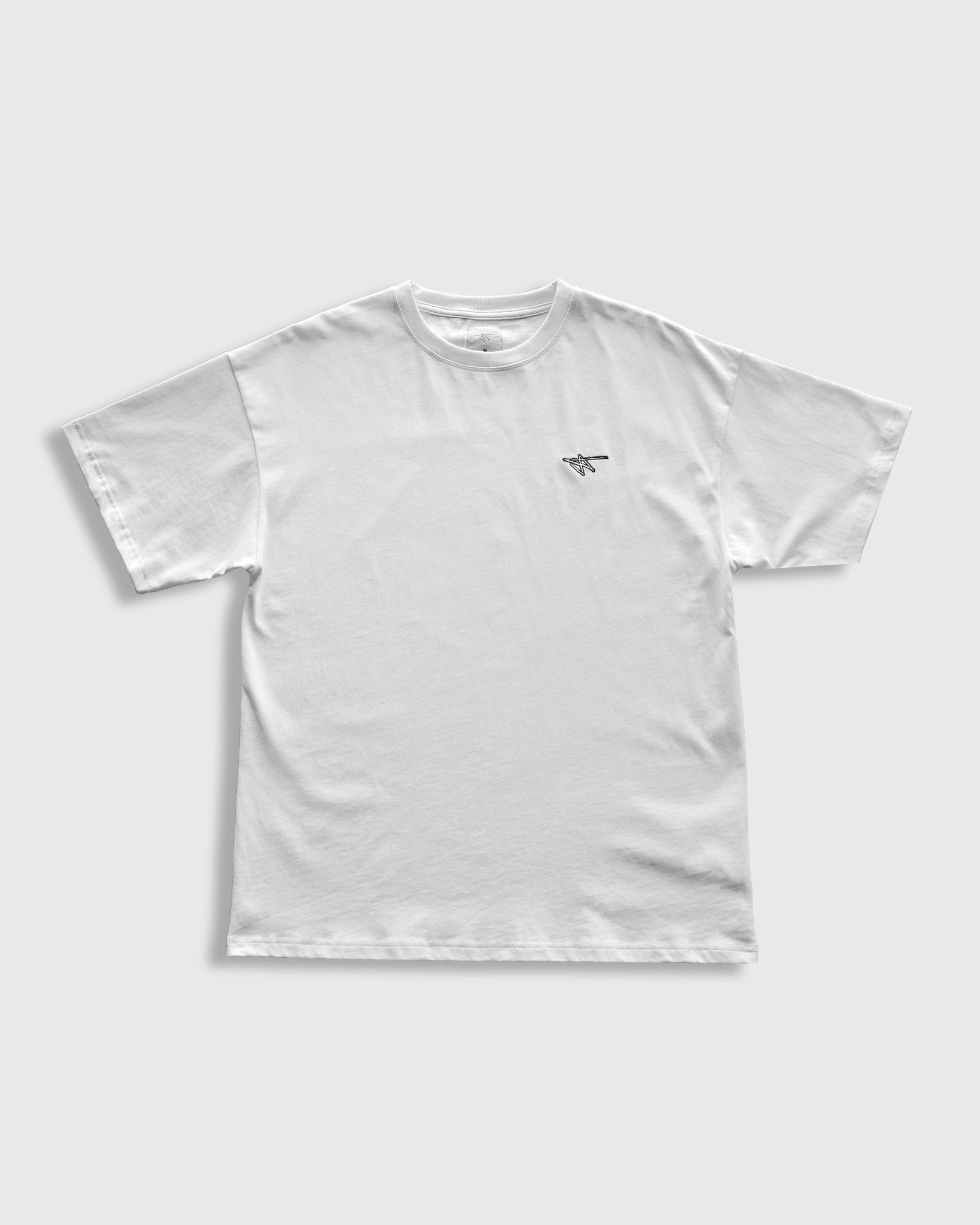 White t-shirt with a small logo on a light gray background