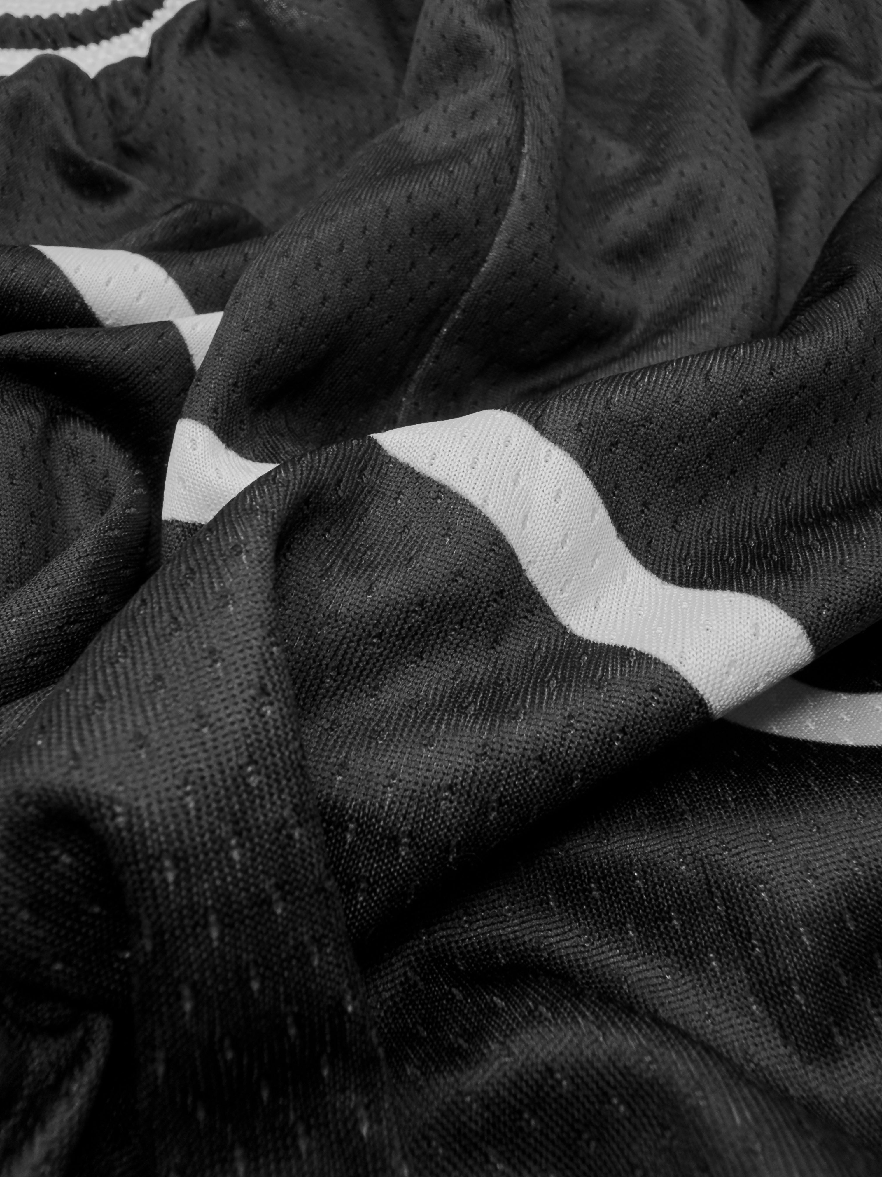 Close-up of black fabric with white stripes